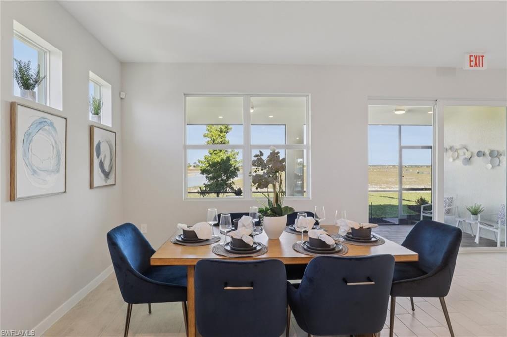 17899 Shade Tree Loop Punta Gorda, FL 33982 - Photo 5 of 47 a view of a dining room with furniture and window