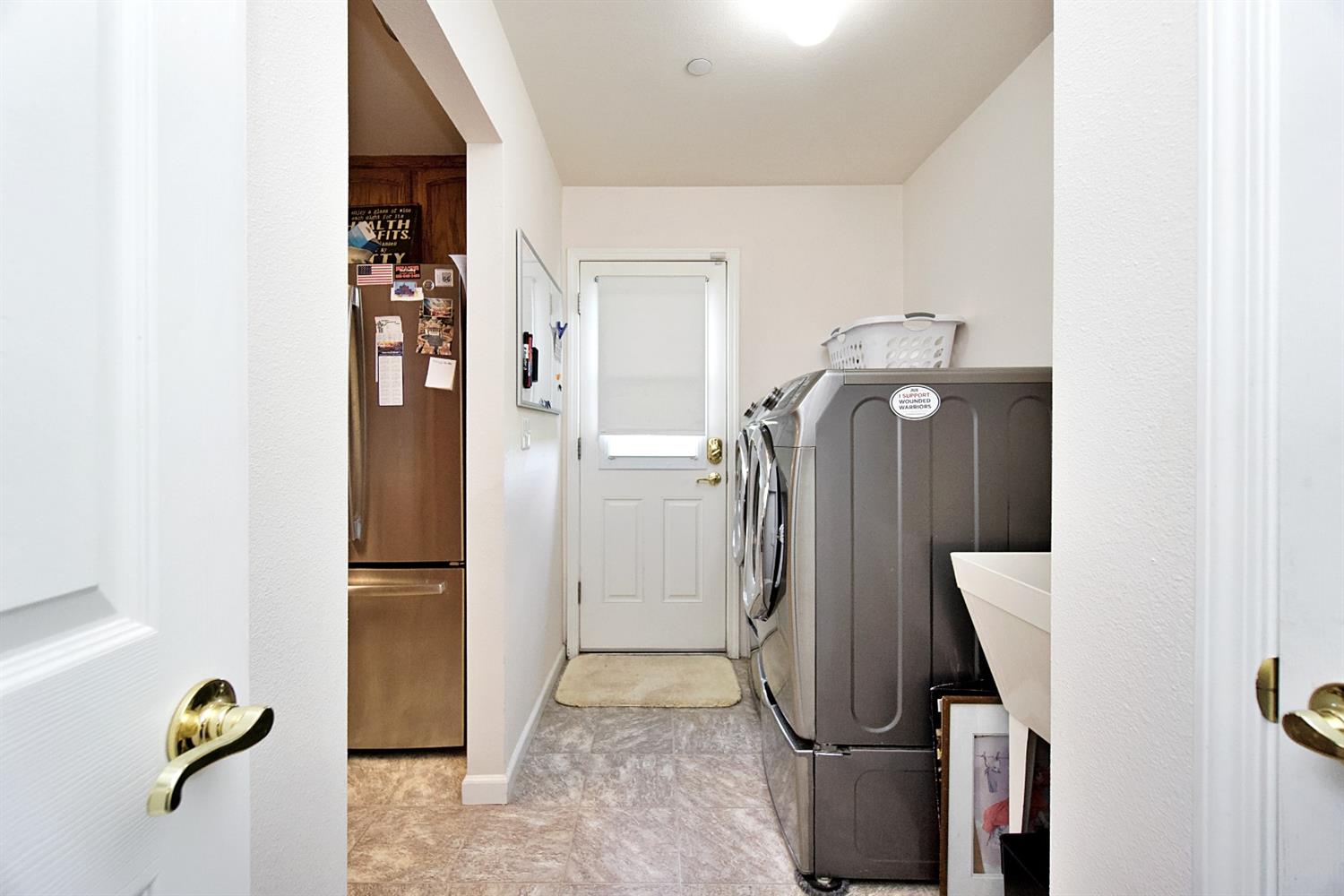 16254 Road 37 Madera, CA 93636 - Photo 13 of 36 a room with a door and wooden floor