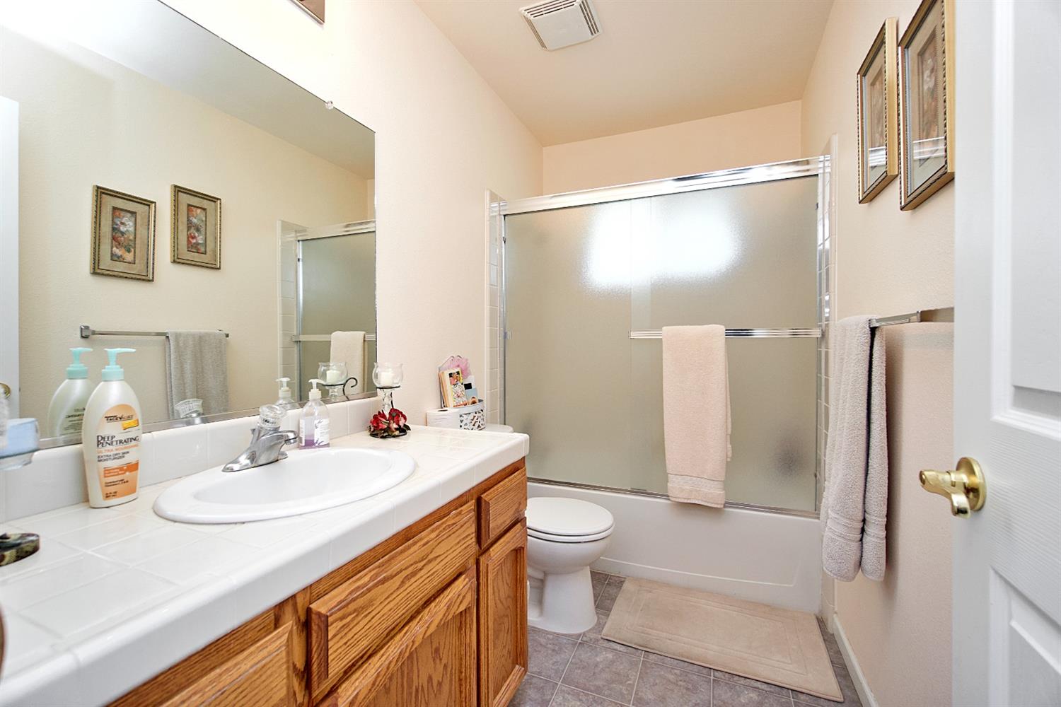 16254 Road 37 Madera, CA 93636 - Photo 14 of 36 a bathroom with a sink toilet and shower