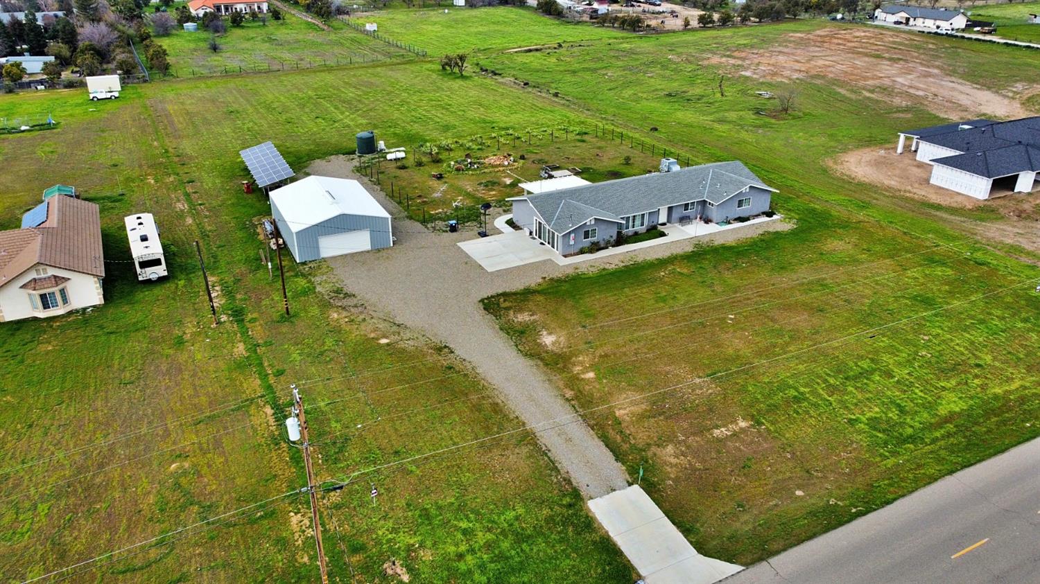 16254 Road 37 Madera, CA 93636 - Photo 27 of 36 a view of a lake with a house