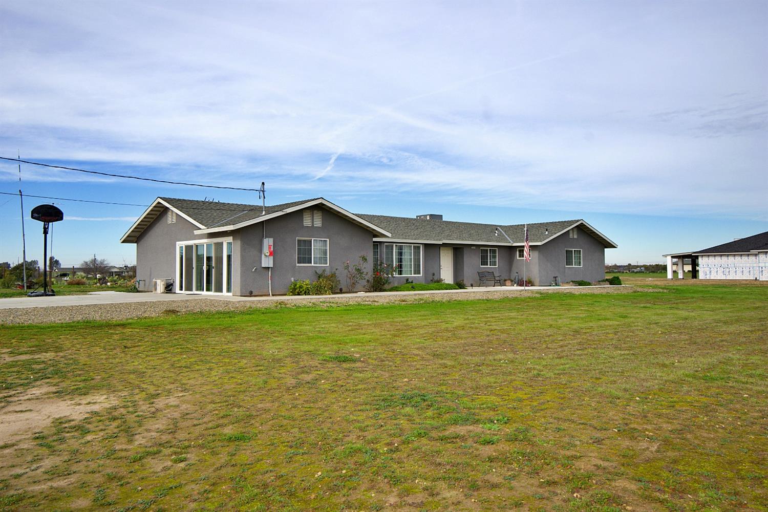16254 Road 37 Madera, CA 93636 - Photo 3 of 36 a front view of house with yard space and swimming pool