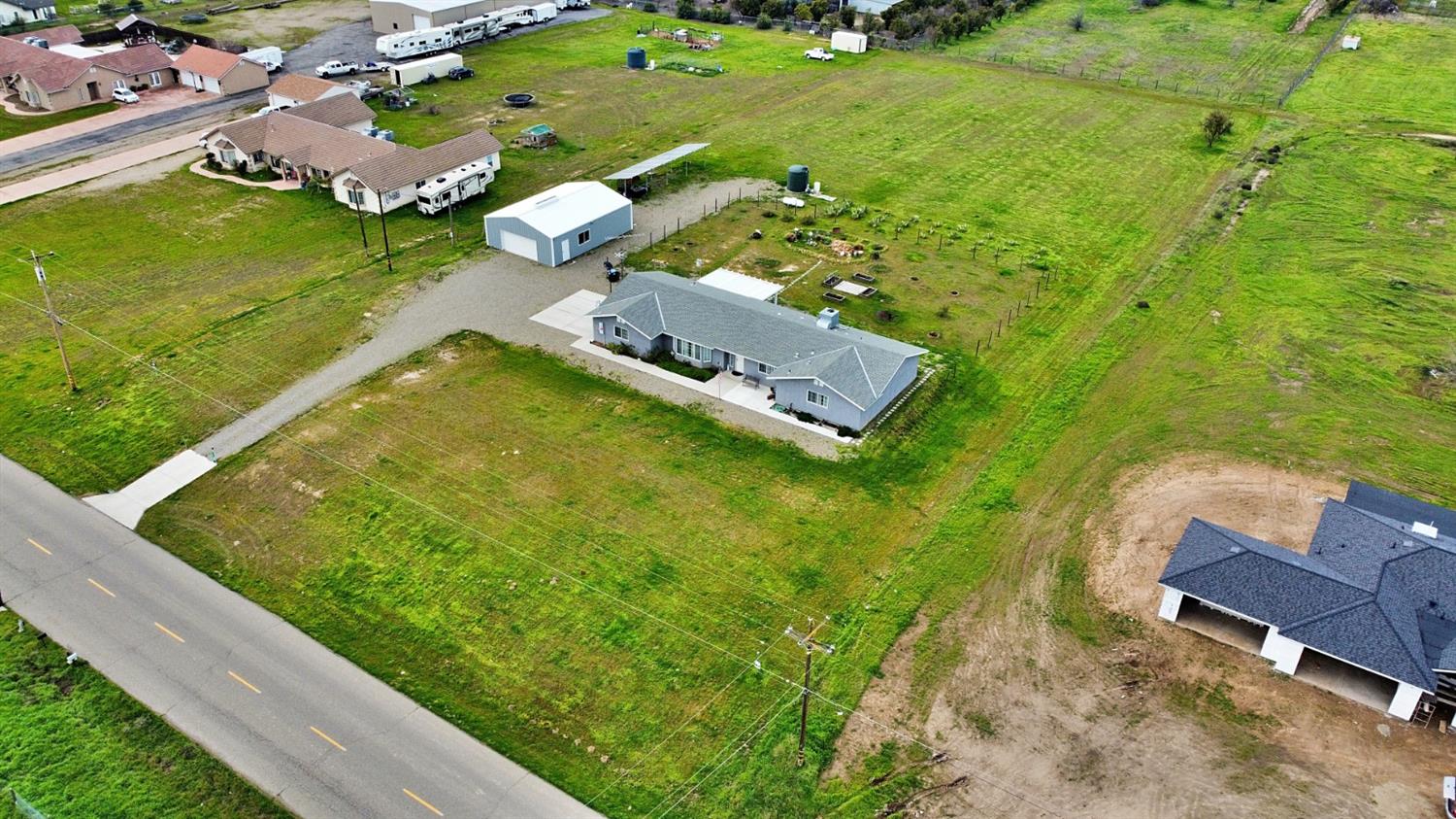 16254 Road 37 Madera, CA 93636 - Photo 31 of 36 an aerial view of a house with a yard