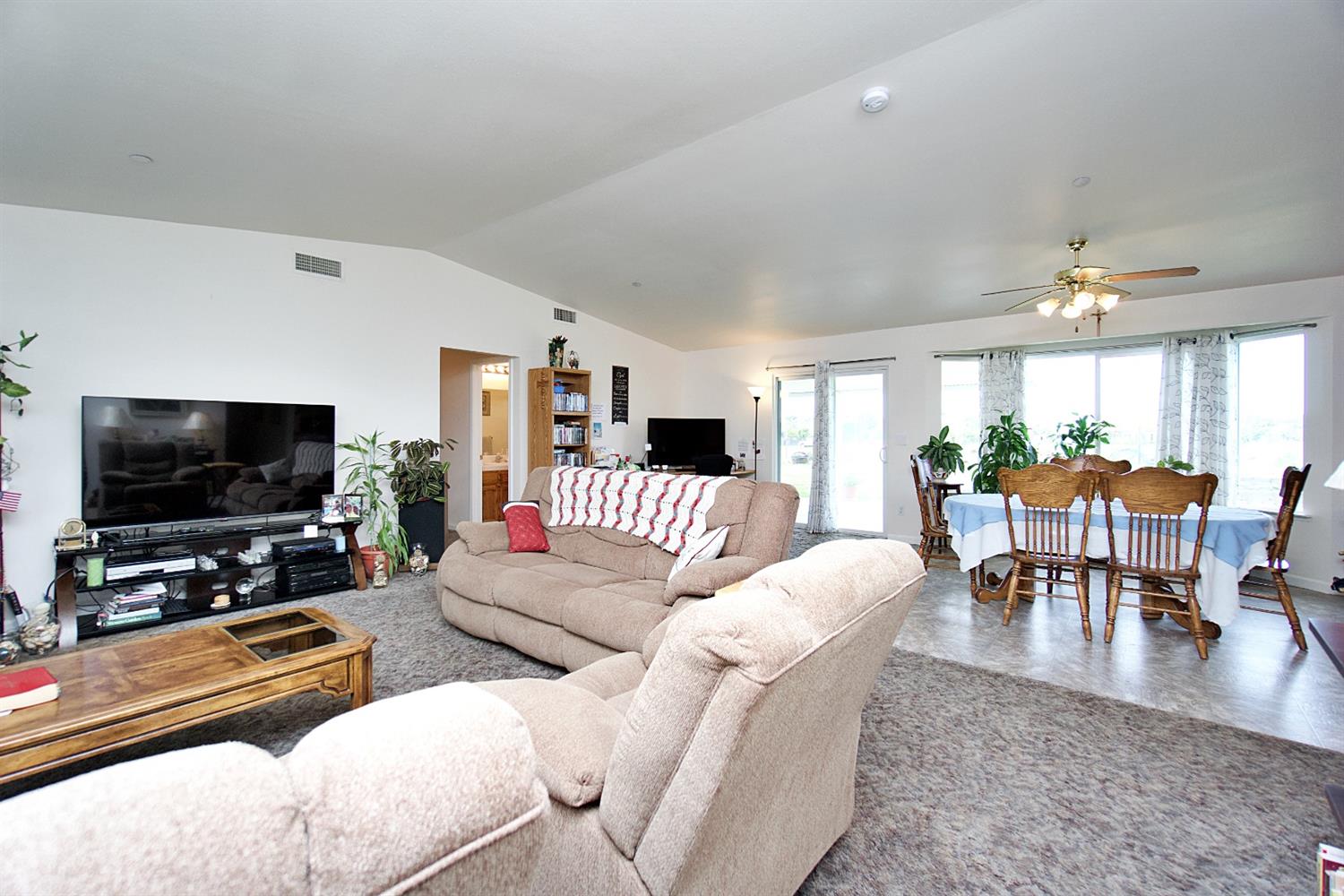 16254 Road 37 Madera, CA 93636 - Photo 7 of 36 a living room with furniture and a flat screen tv