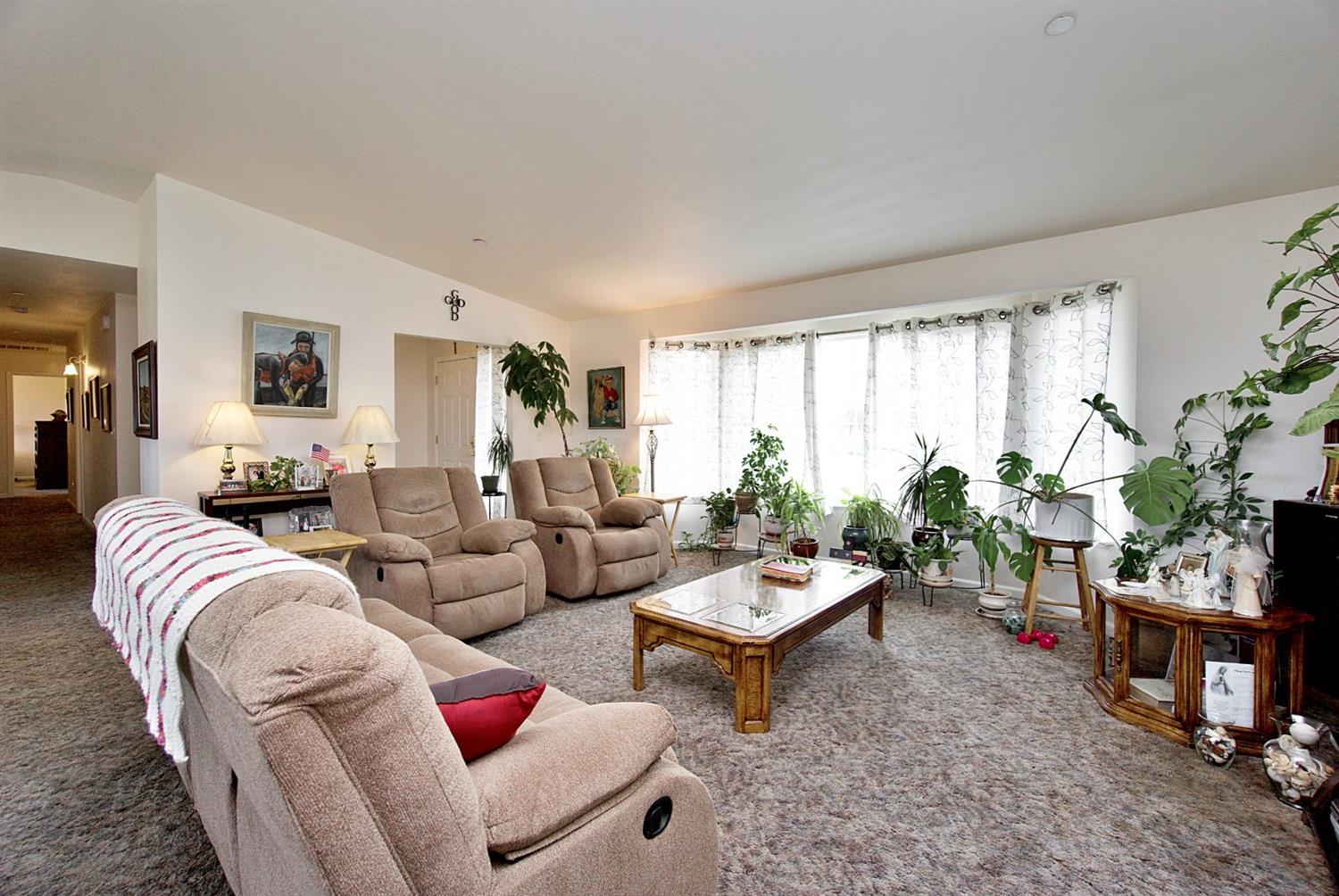 16254 Road 37 Madera, CA 93636 - Photo 8 of 36 a living room with furniture and a large window