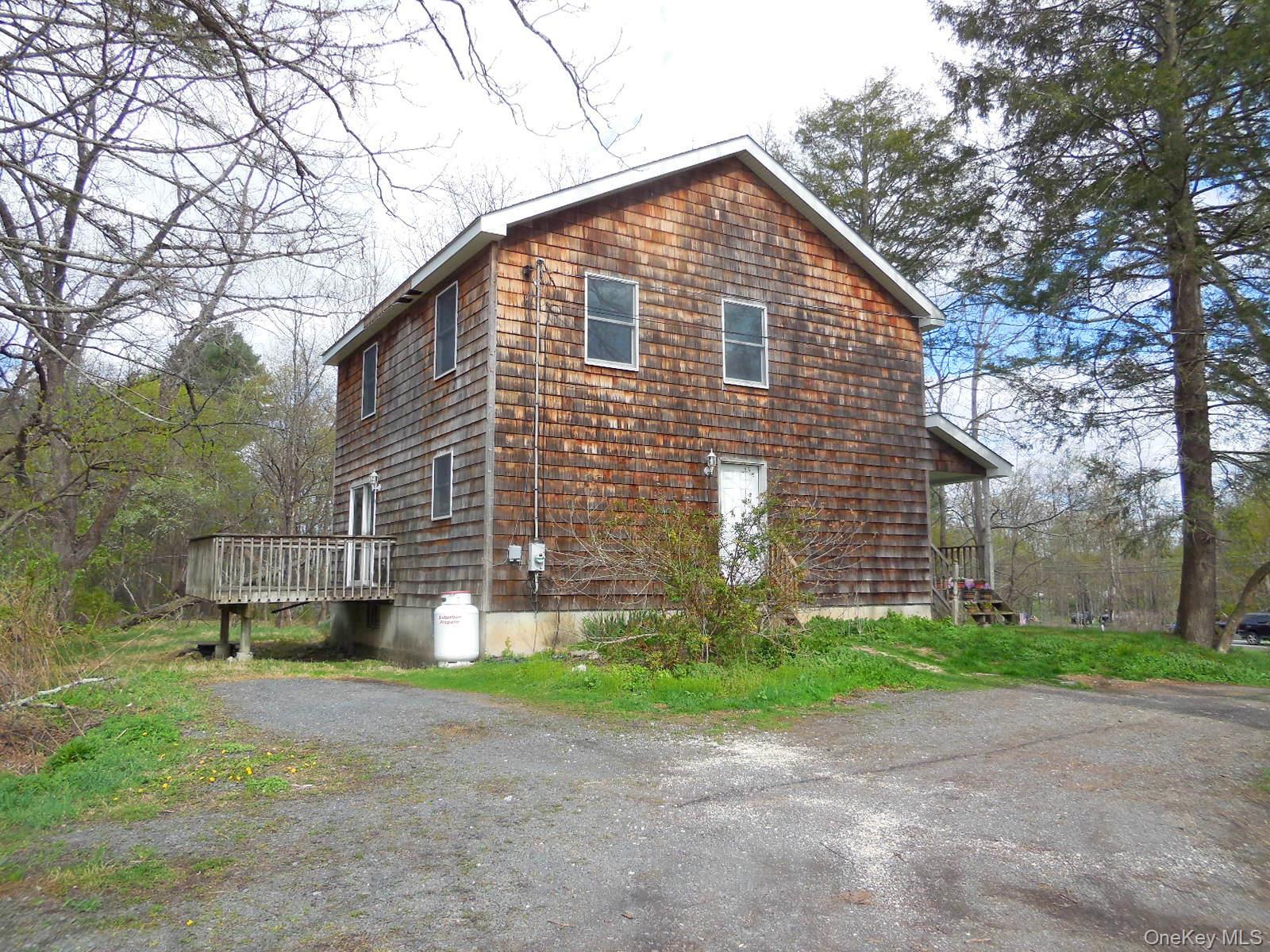 617 Burlingham Road Bloomingburg, NY 12721 - Photo 2 of 9 Side & back view with deck and parking area
