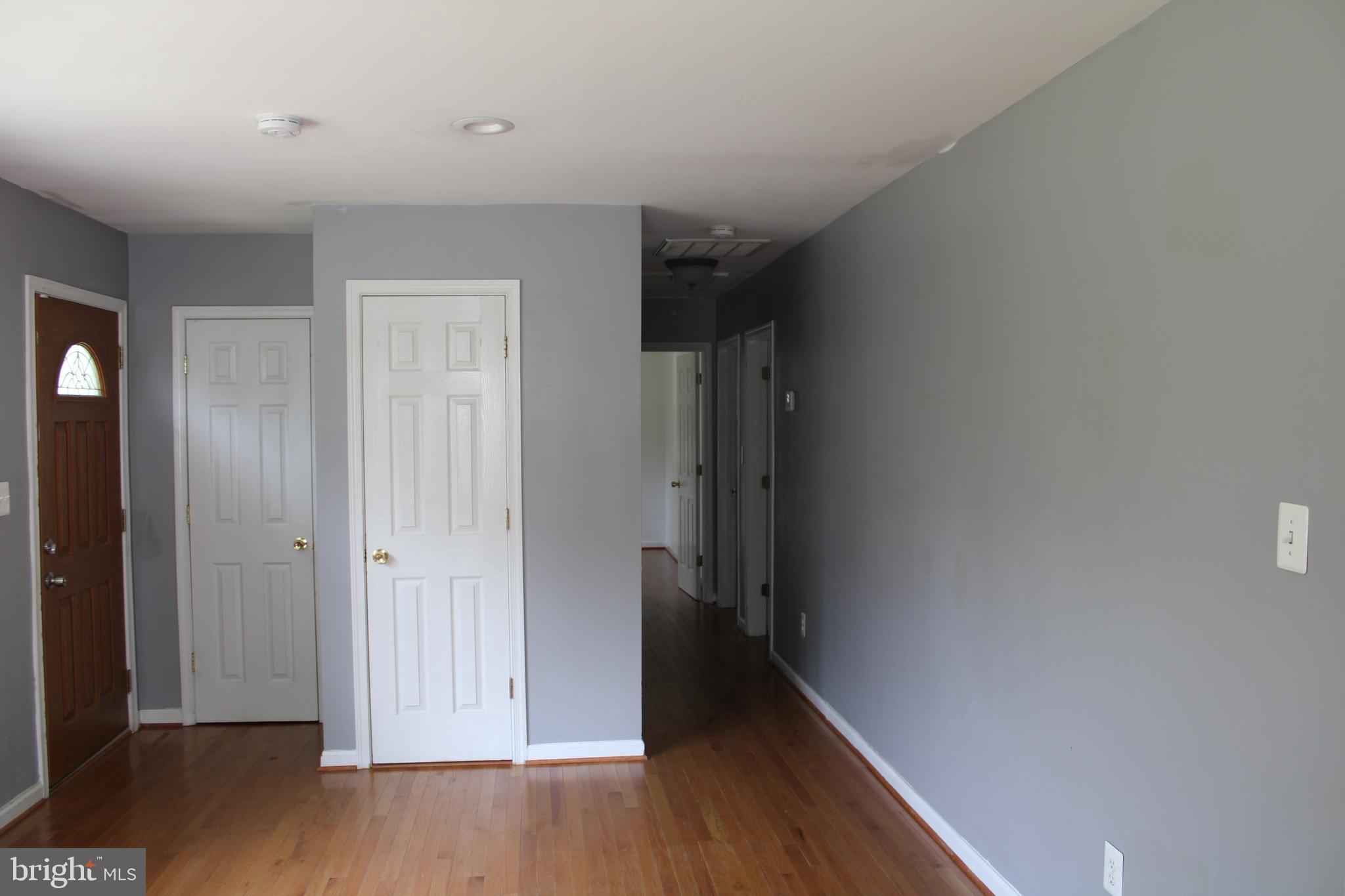 19115 Wayne Drive Triangle, VA 22172 - Photo 20 of 47 a view of a hallway with wooden floor
