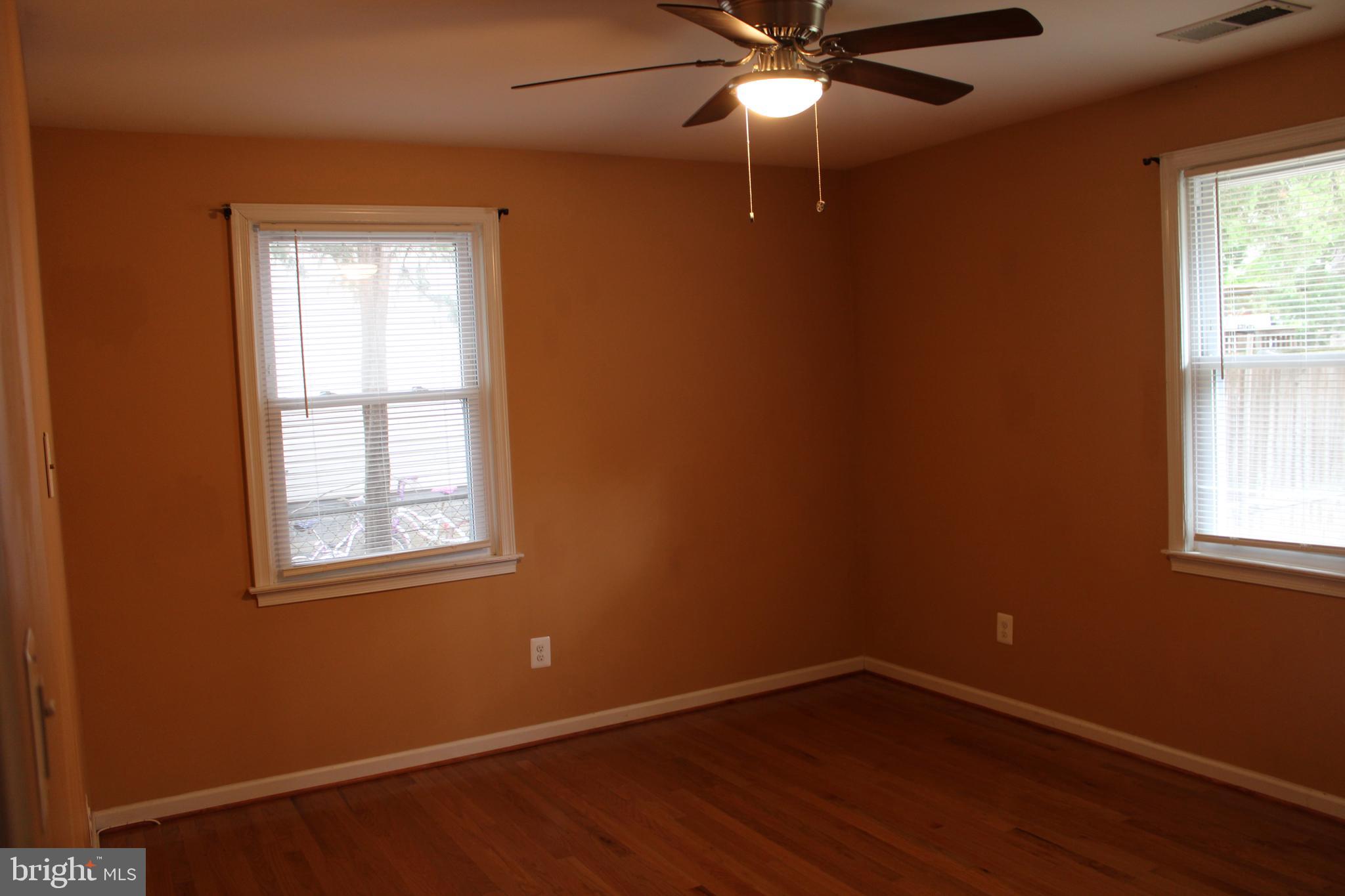 19115 Wayne Drive Triangle, VA 22172 - Photo 28 of 47 an empty room with windows and fan