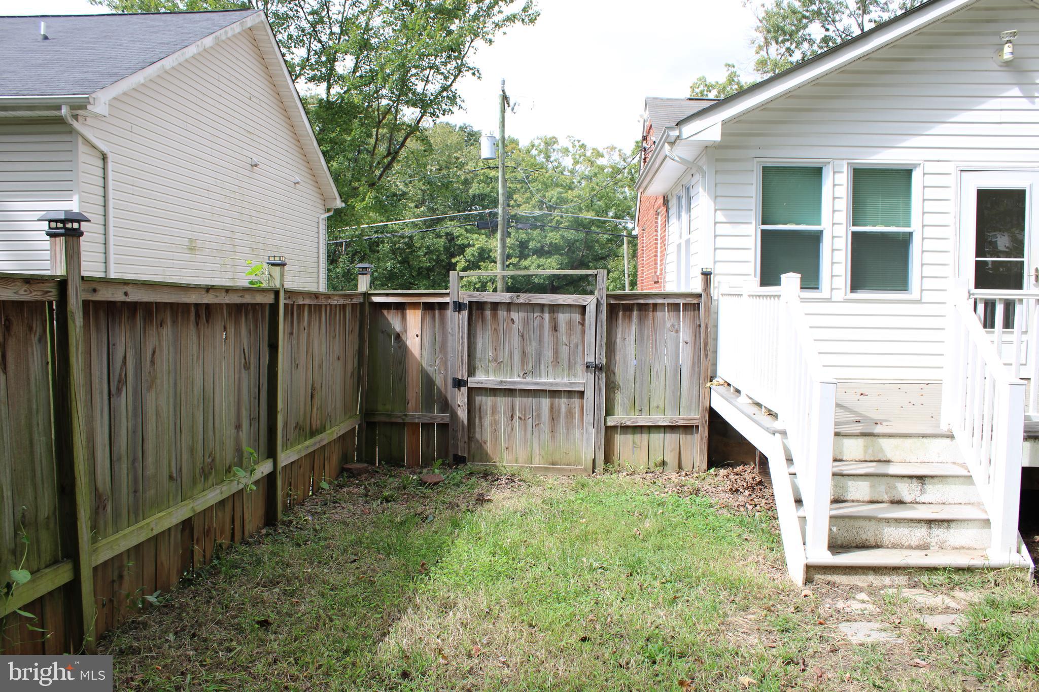 19115 Wayne Drive Triangle, VA 22172 - Photo 40 of 47 a view of a house with backyard and wooden fence