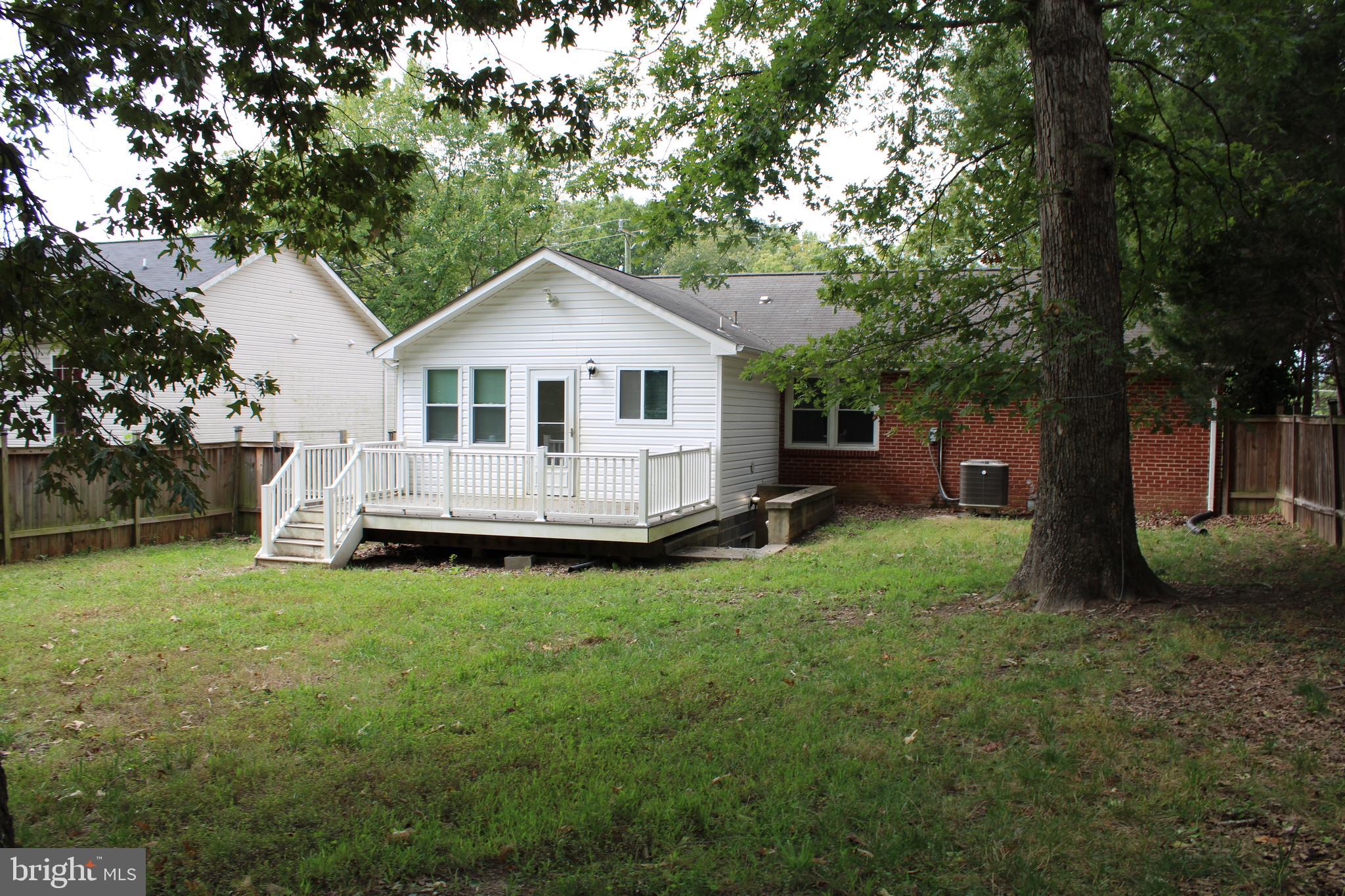 19115 Wayne Drive Triangle, VA 22172 - Photo 43 of 47 a view of a house with a backyard
