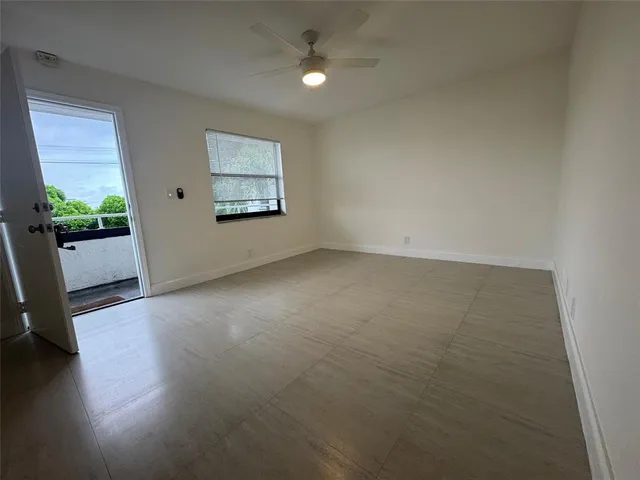 an empty room with windows and window