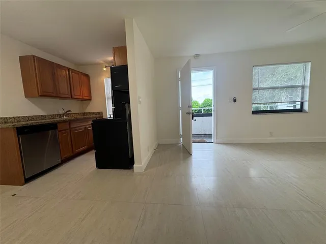 a view of a kitchen with a sink cabinets and a window
