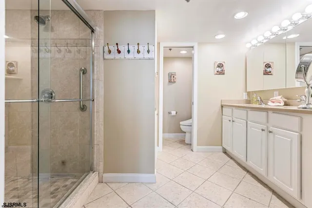 a bathroom with a shower sink and toilet