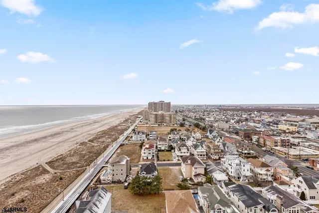 an aerial view of beach and ocean