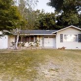 a front view of a house with swimming pool
