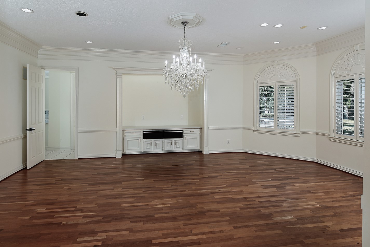 23508 Twin Oaks Drive Spring, TX 77389 - Photo 12 of 50 a view of an empty room with wooden floor and a window