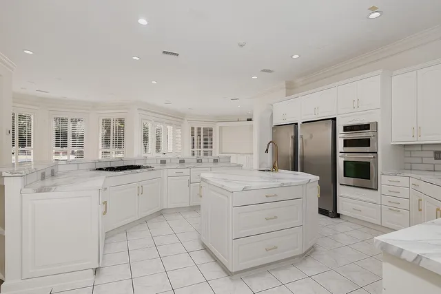 an empty room with ceiling fan and window