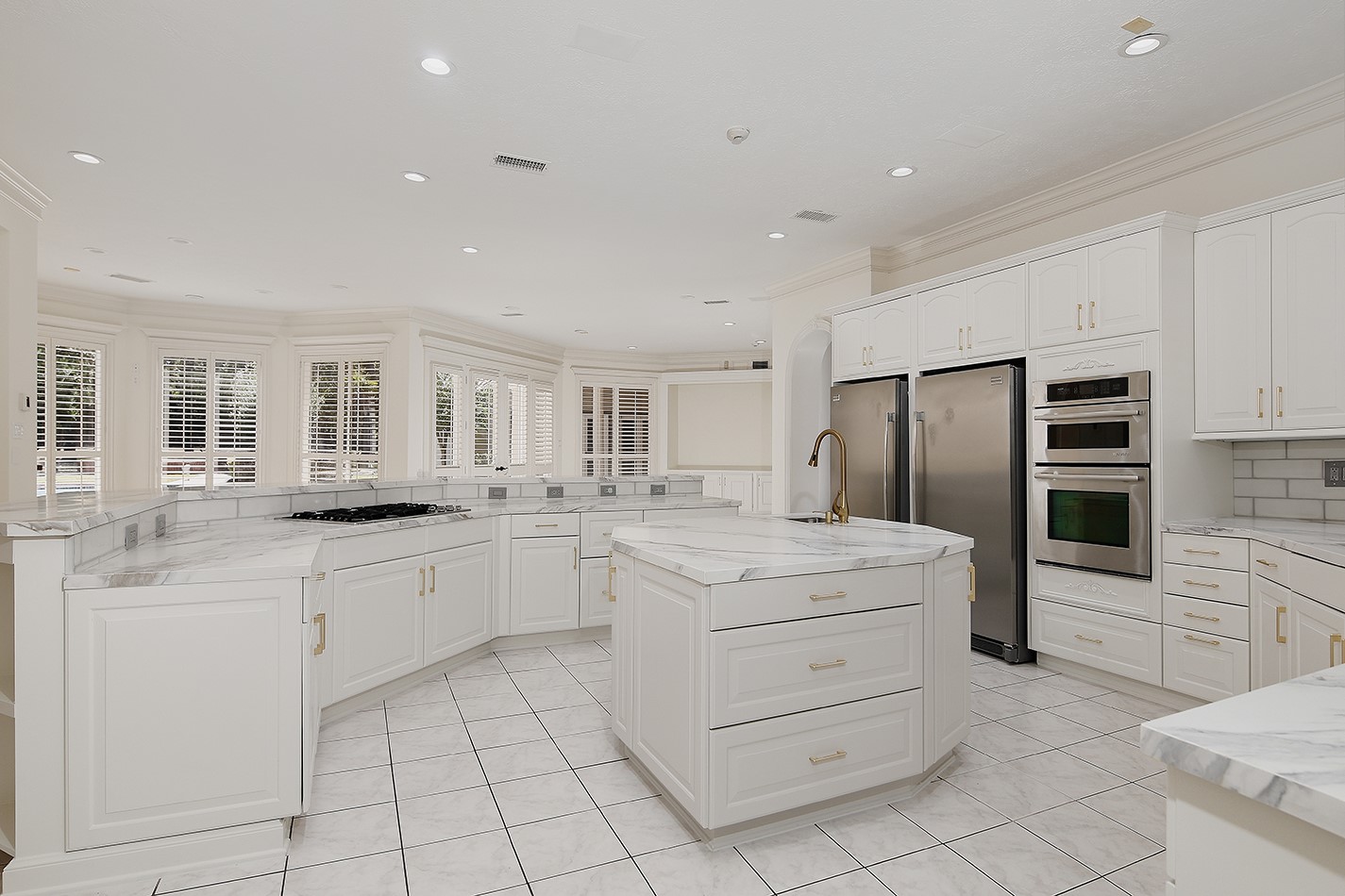 23508 Twin Oaks Drive Spring, TX 77389 - Photo 15 of 50 a kitchen with white cabinets and stainless steel appliances