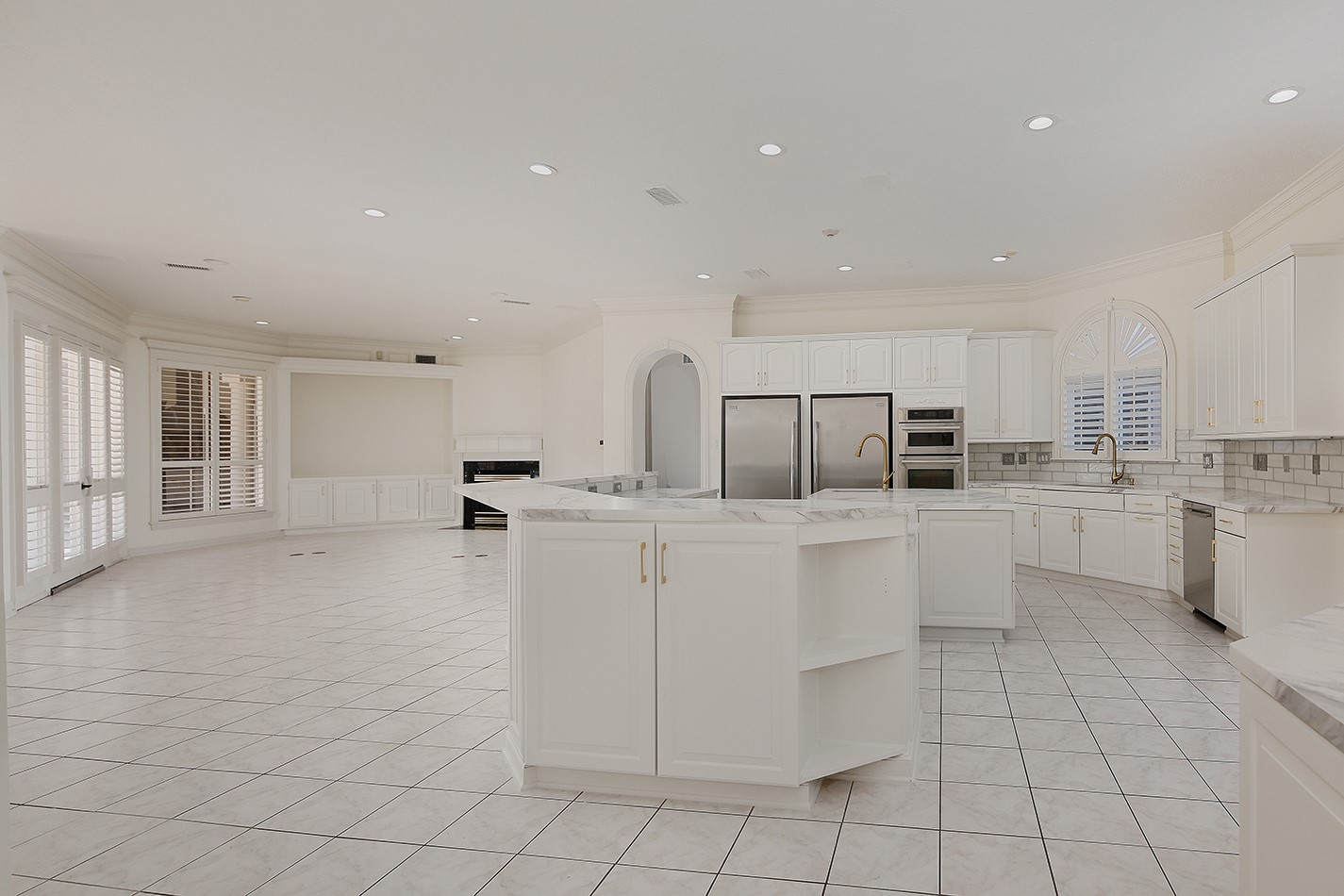 23508 Twin Oaks Drive Spring, TX 77389 - Photo 16 of 50 a kitchen with white cabinets and appliances