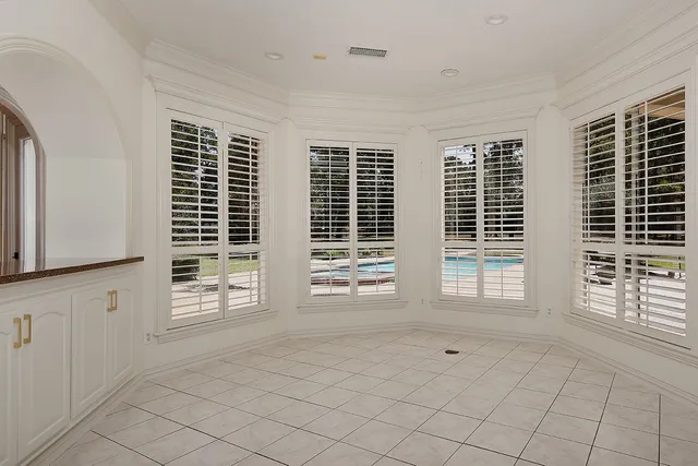 a view of cabinets and window in a room