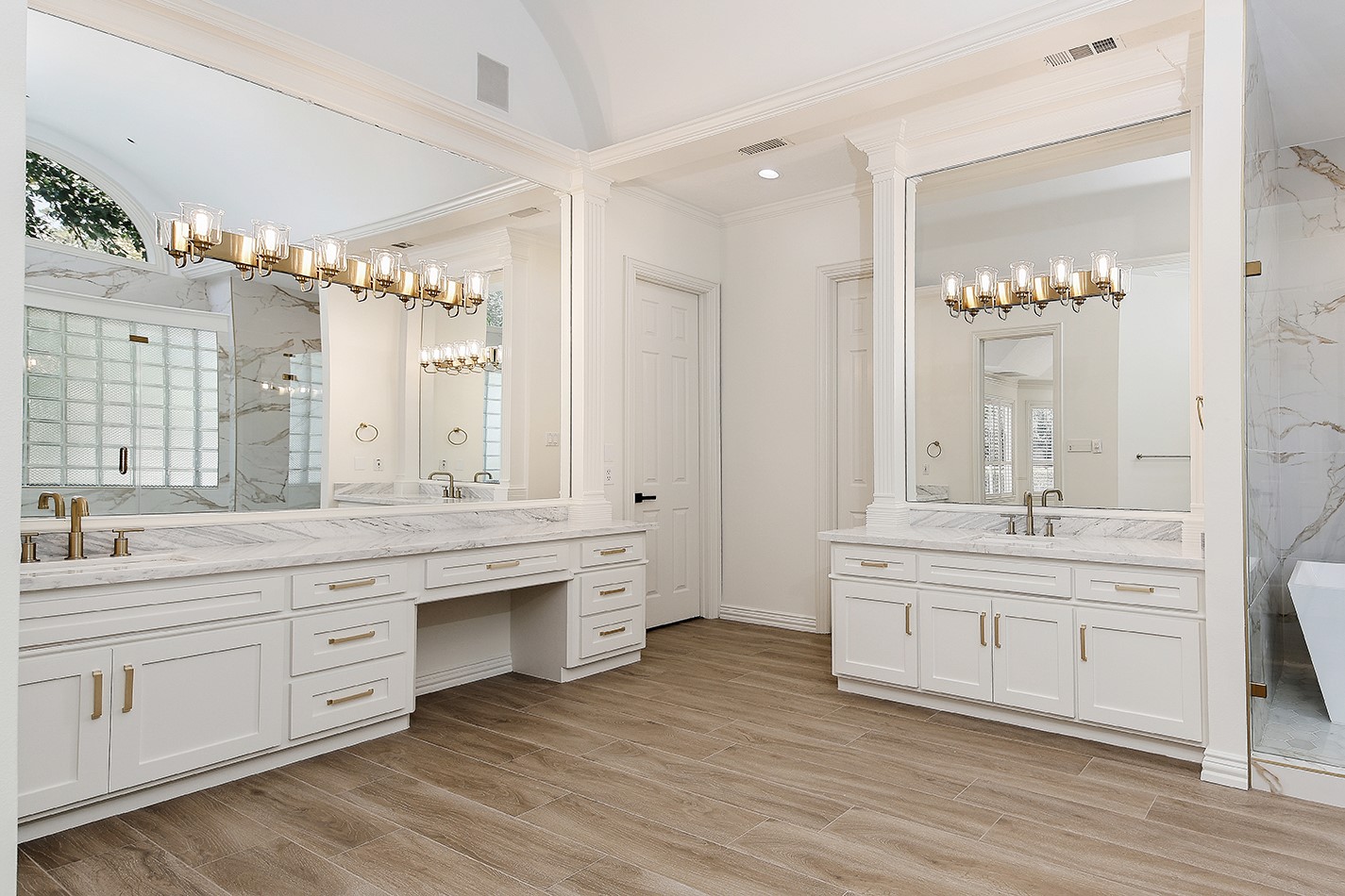23508 Twin Oaks Drive Spring, TX 77389 - Photo 25 of 50 a spacious bathroom with a granite countertop double vanity sink a mirror and a bathtub