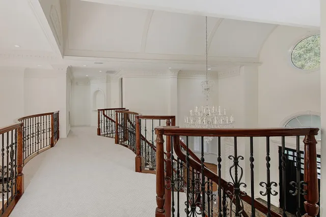 a front view of a house with a yard table and chairs