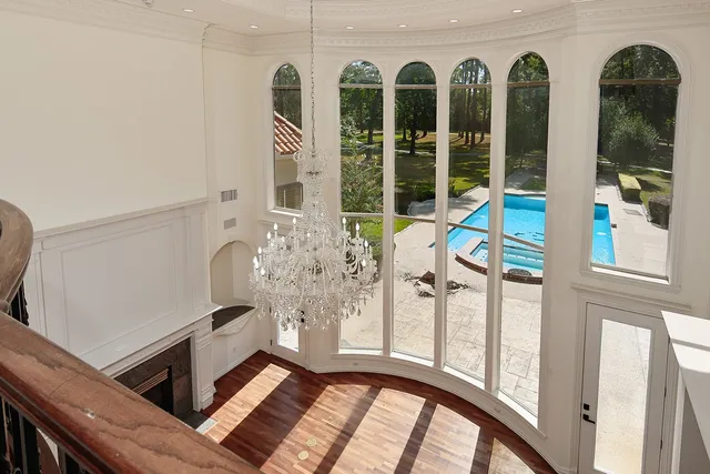a view of a swimming pool with an outdoor space and seating area