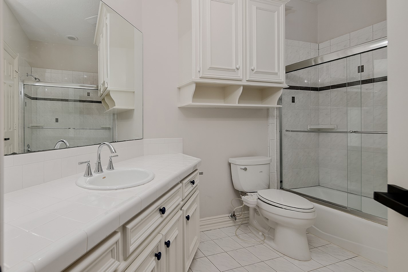 23508 Twin Oaks Drive Spring, TX 77389 - Photo 30 of 50 a bathroom with a sink toilet and vanity