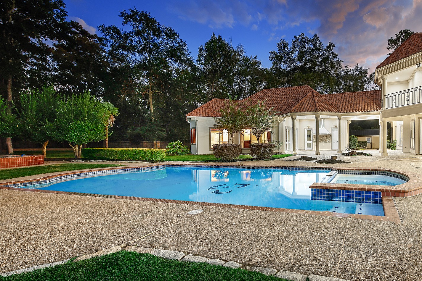 23508 Twin Oaks Drive Spring, TX 77389 - Photo 47 of 50 a view of pool with a table and chairs under an umbrella