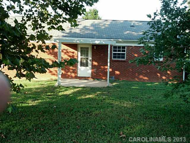 2201 Dawn Ridge Monroe, NC 28110 - Photo 5 of 8 a backyard of a house with table and chairs
