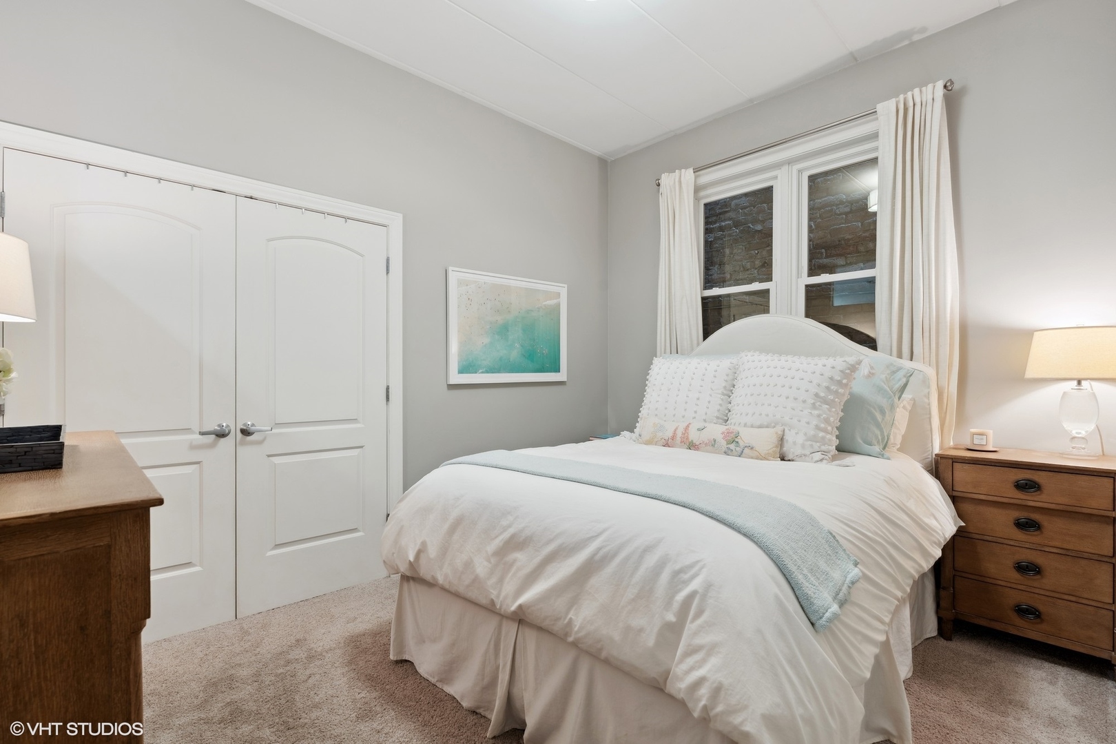 1332 West Madison Street, Unit 3E Chicago, IL 60607 - Photo 11 of 14 a bedroom with a bed and a window