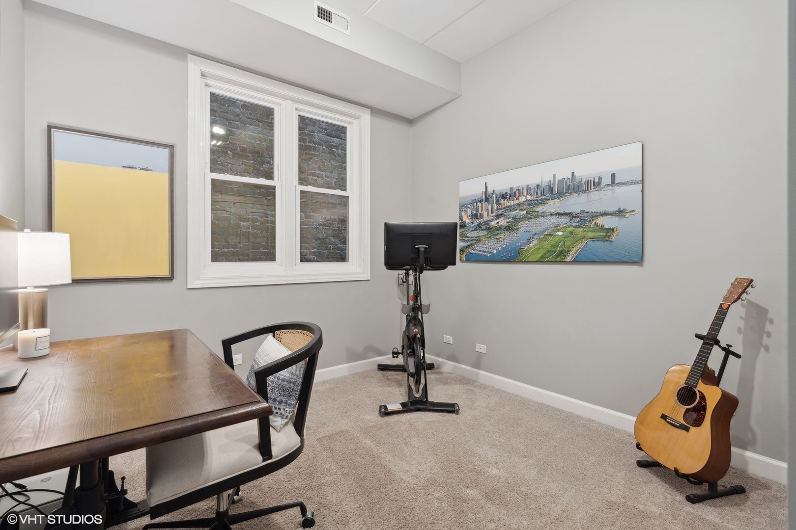 1332 West Madison Street, Unit 3E Chicago, IL 60607 - Photo 12 of 14 a view of a workspace with furniture and a window