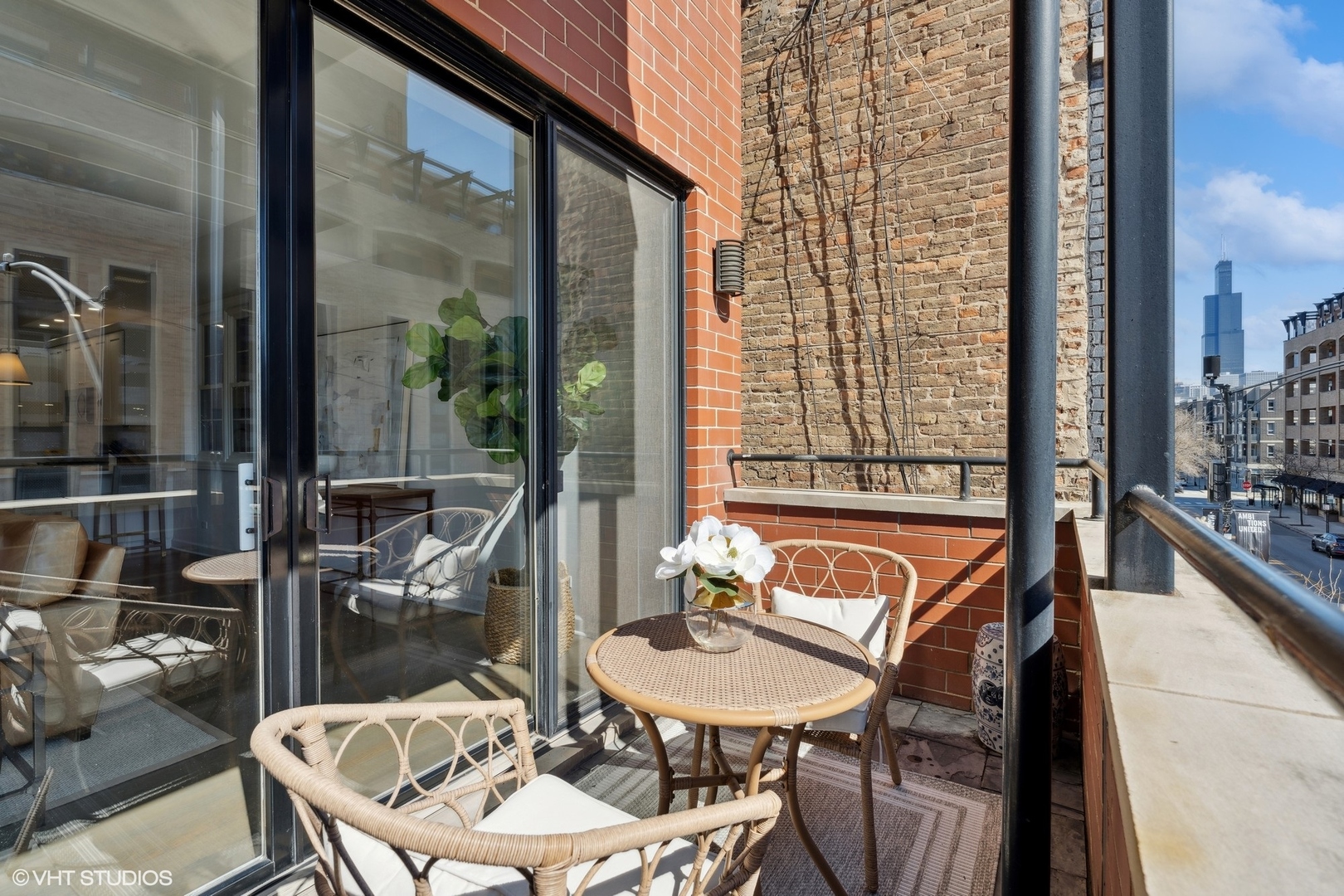 1332 West Madison Street, Unit 3E Chicago, IL 60607 - Photo 14 of 14 a balcony with table and chairs