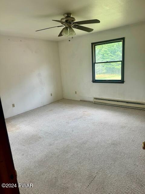 164 Tuthill Road Waymart, PA 18472 - Photo 20 of 33 an empty room with windows and fan