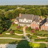 aerial view of a house with a big yard