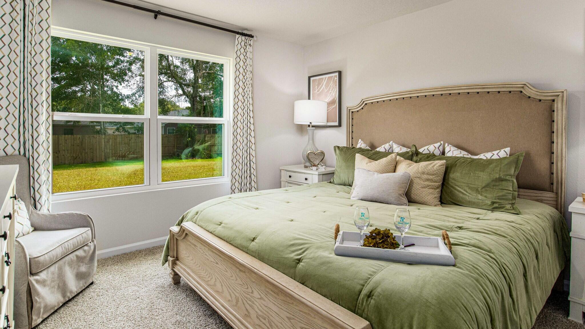 3406 Phoenix Court Crestview, FL 32539 - Photo 11 of 31 a bed sitting in a bedroom next to a window