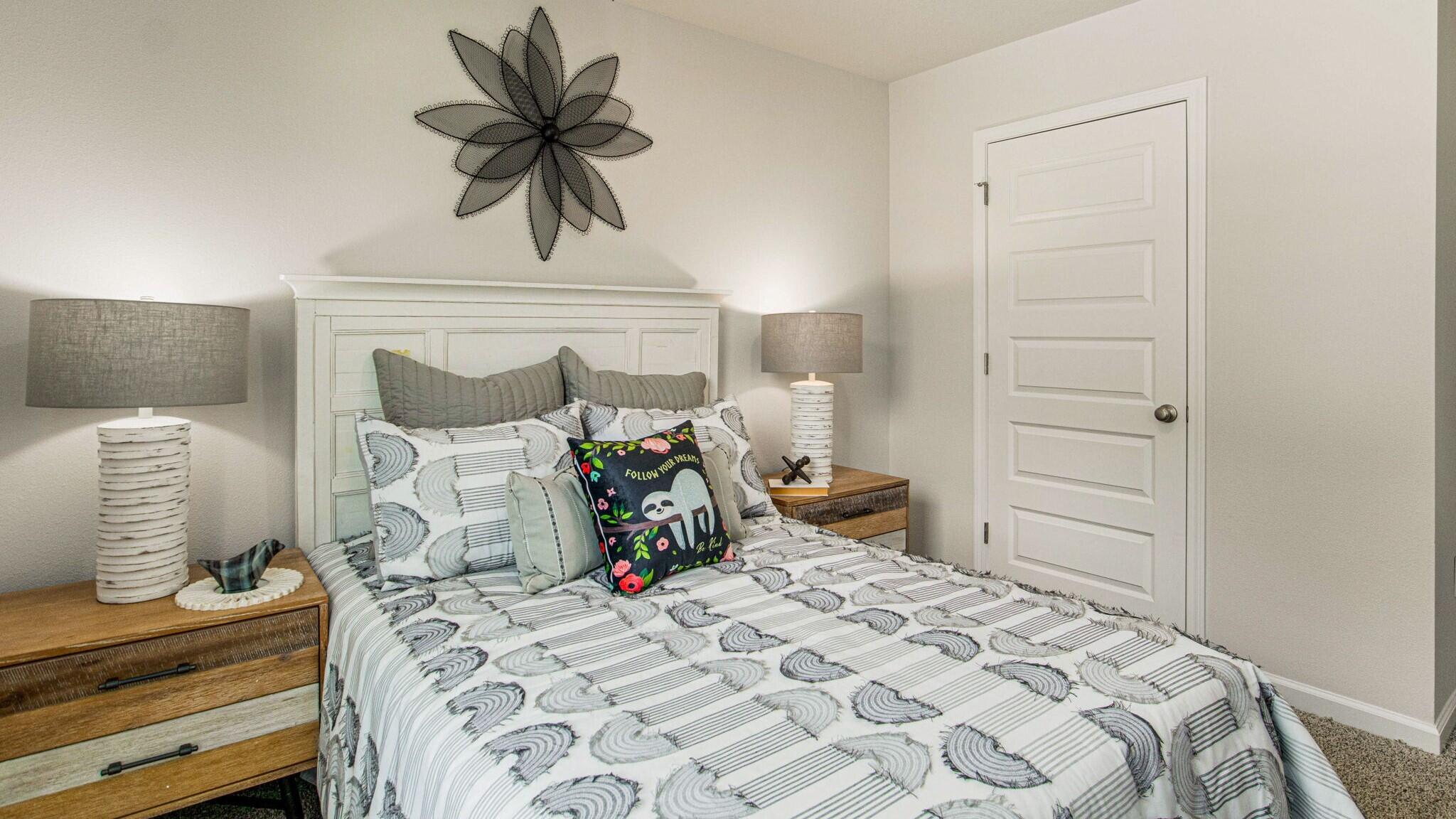 3406 Phoenix Court Crestview, FL 32539 - Photo 19 of 31 a bedroom with a bed and a chandelier