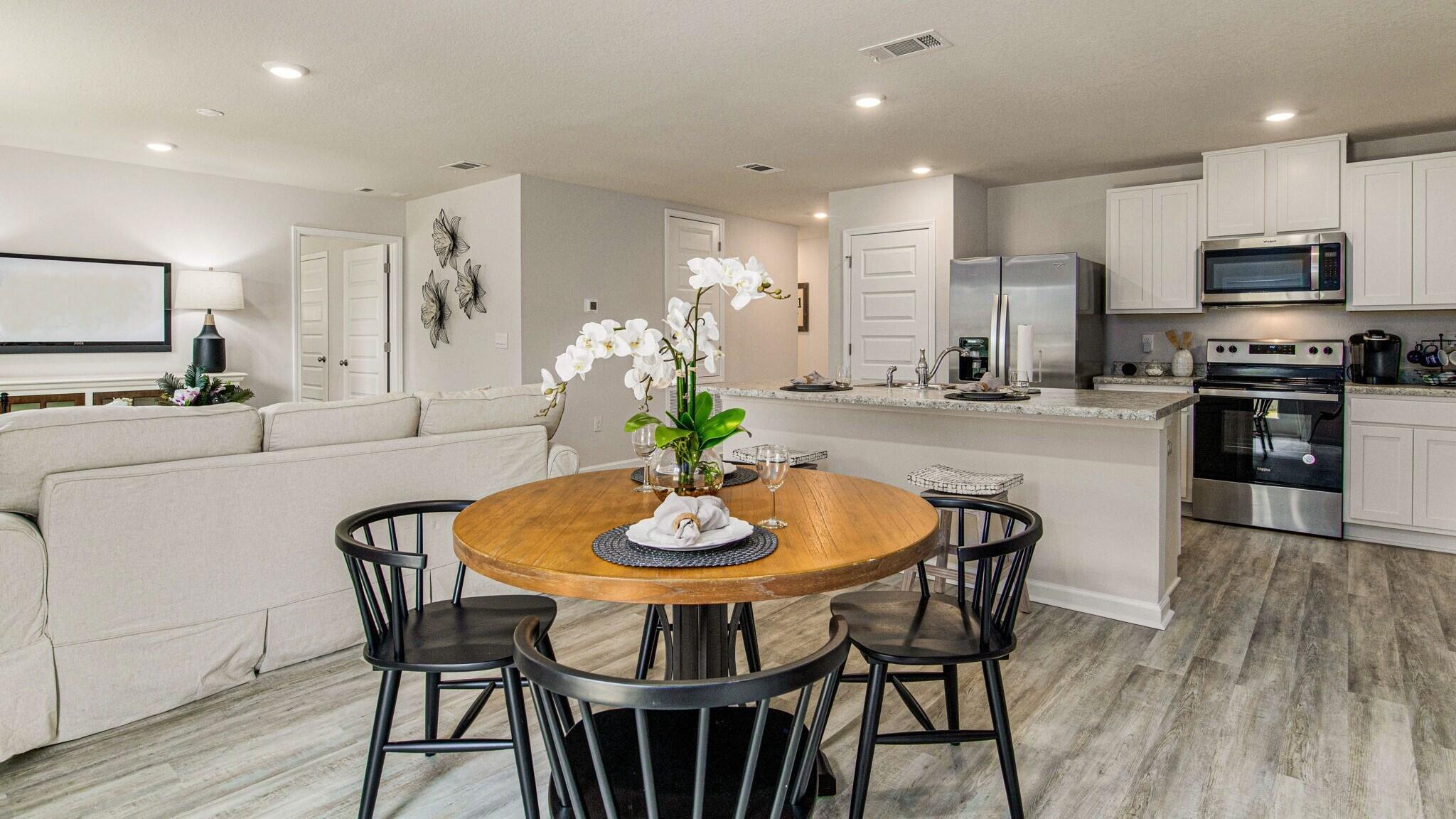 3406 Phoenix Court Crestview, FL 32539 - Photo 5 of 31 a kitchen with stainless steel appliances kitchen island granite countertop a kitchen island hardwood floor and a sink
