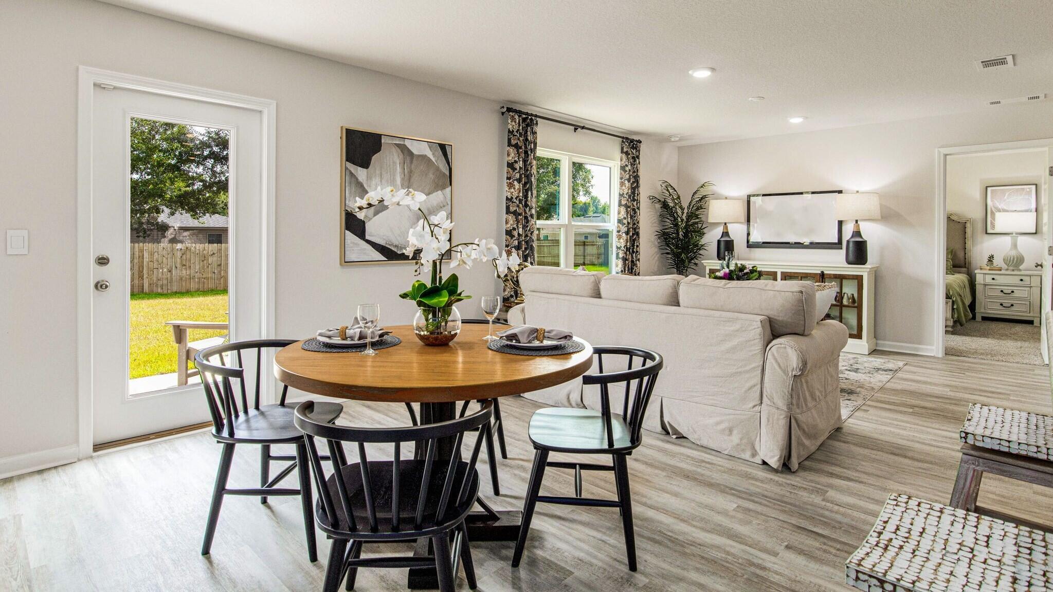 3406 Phoenix Court Crestview, FL 32539 - Photo 7 of 31 a view of a dining room with furniture and wooden floor