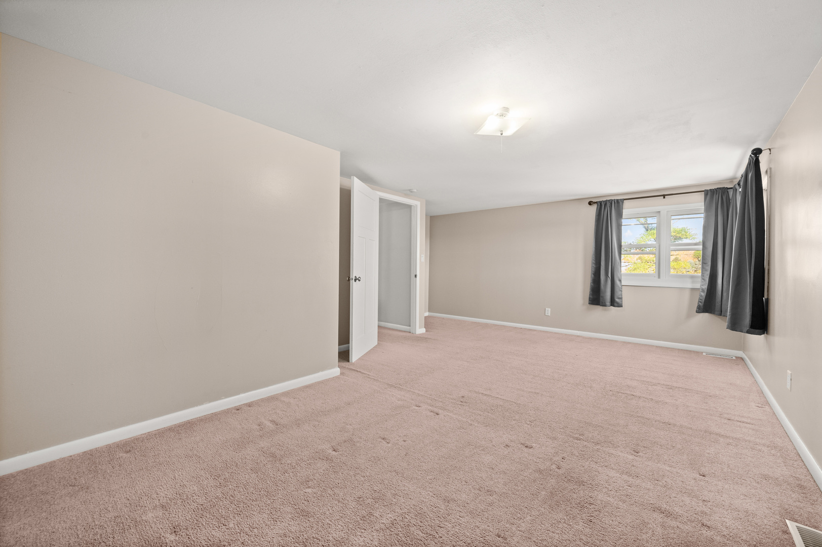 29290 Glidden Road Kingston, IL 60145 - Photo 20 of 38 a view of an empty room with window and wooden floor