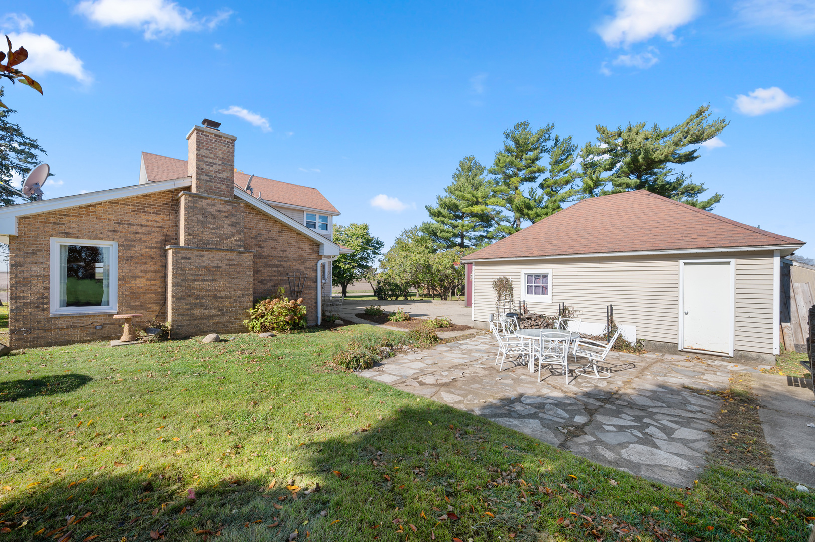 29290 Glidden Road Kingston, IL 60145 - Photo 30 of 38 a view of a house with backyard sitting area and garden