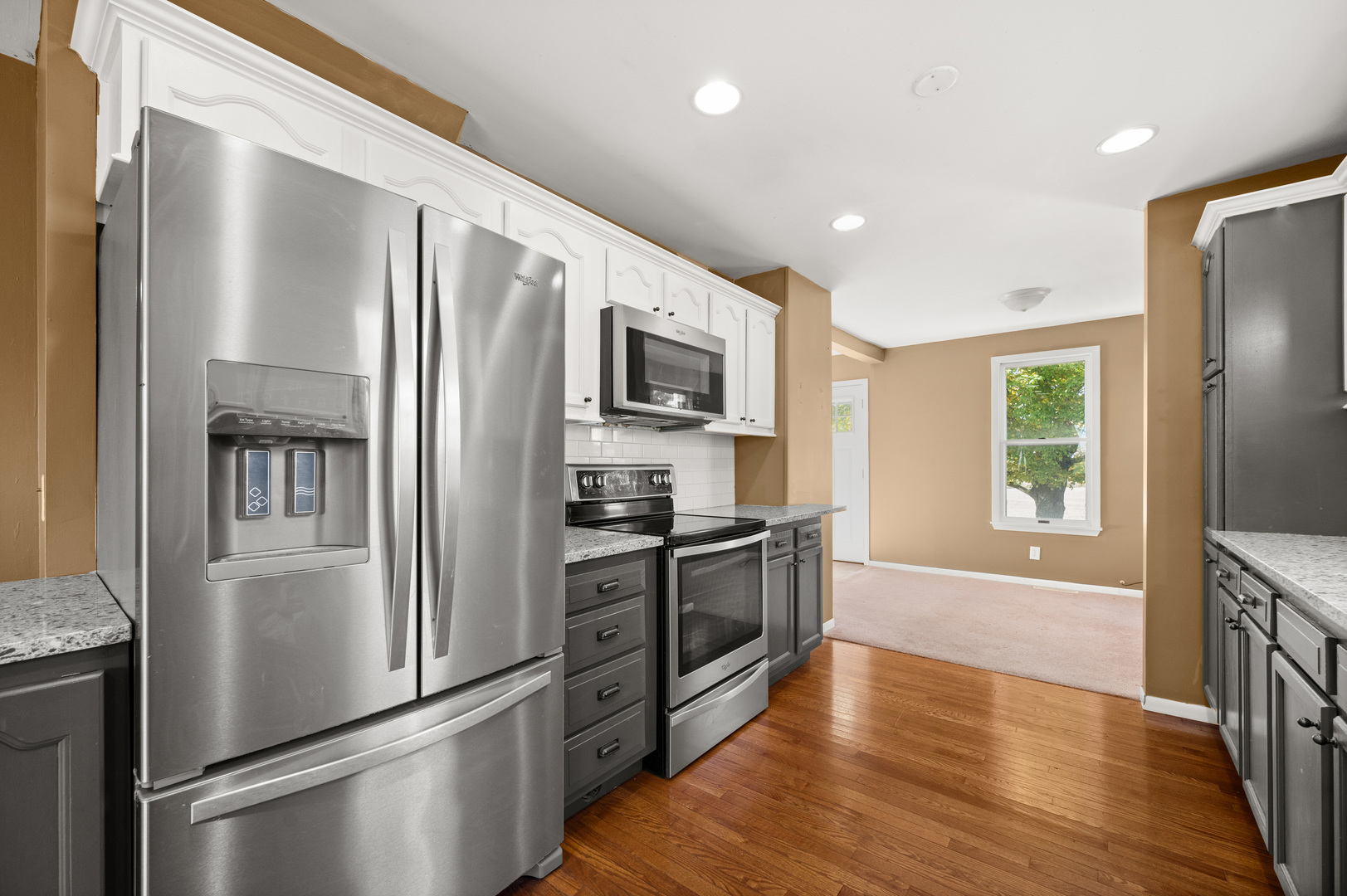 29290 Glidden Road Kingston, IL 60145 - Photo 9 of 38 a kitchen with stainless steel appliances granite countertop a refrigerator a stove top oven a sink and dishwasher
