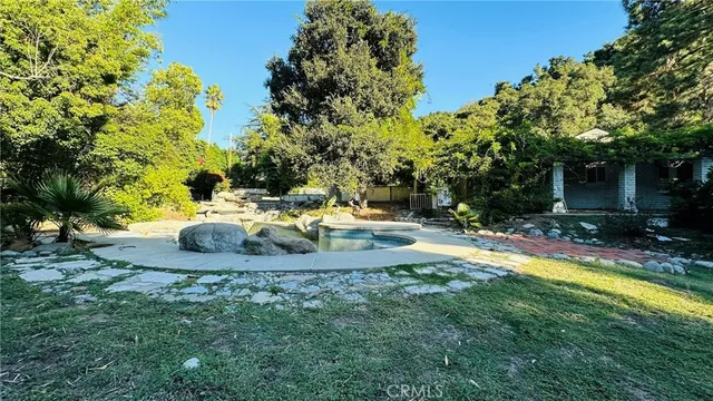 a view of a swimming pool with a patio