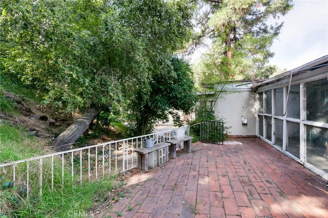 a view of a chair and table on the wooden floor