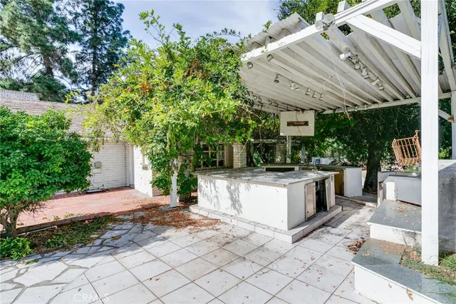 a view of a chairs and table in the patio