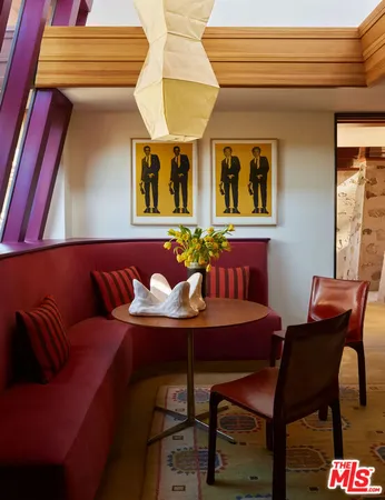 a outdoor living space with furniture and wall paintings