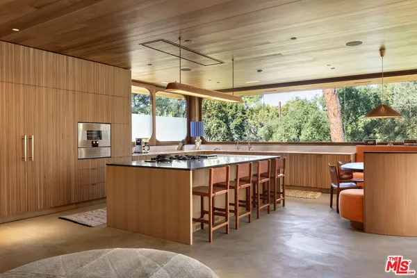 a view of a living room with a large window