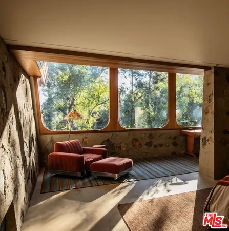 a room with furniture and a large window