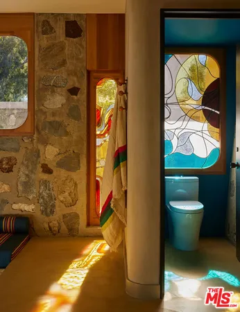 a bathroom with a toilet and a sink