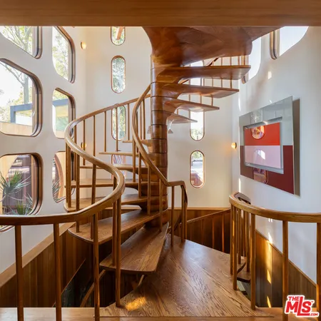 a view of entryway livingroom and hall with wooden floor