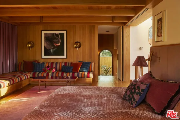 a view of a livingroom with furniture and entryway